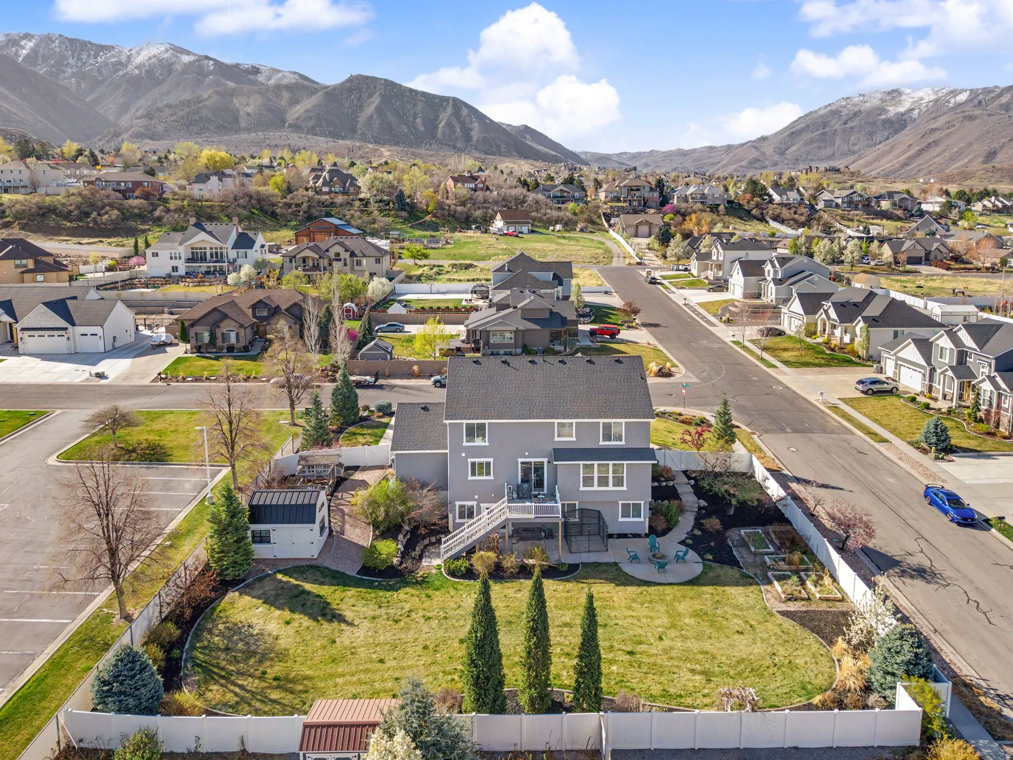 Aerial view of residential area featuring mountains