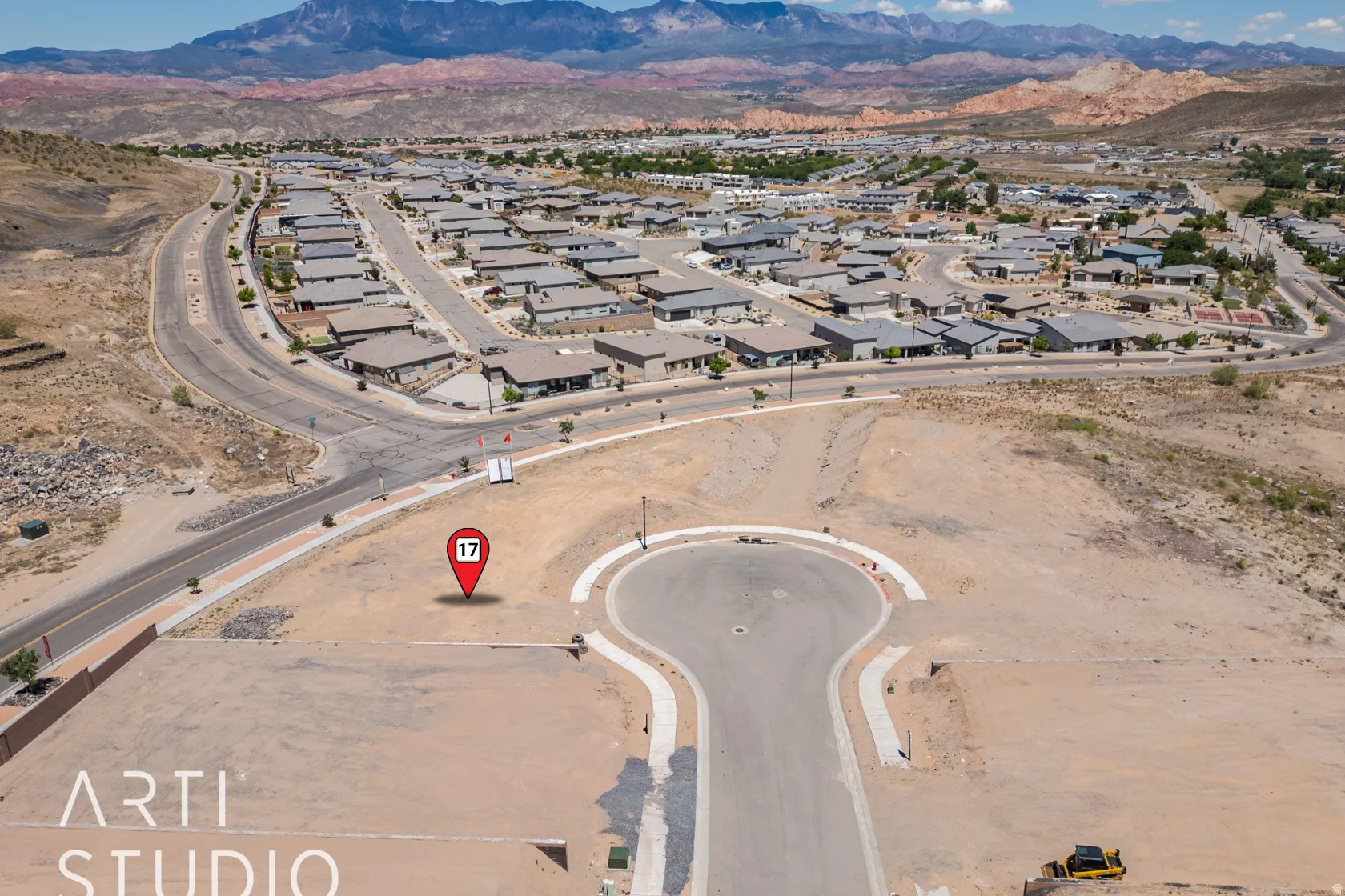 Aerial view of residential area featuring a mountain backdrop