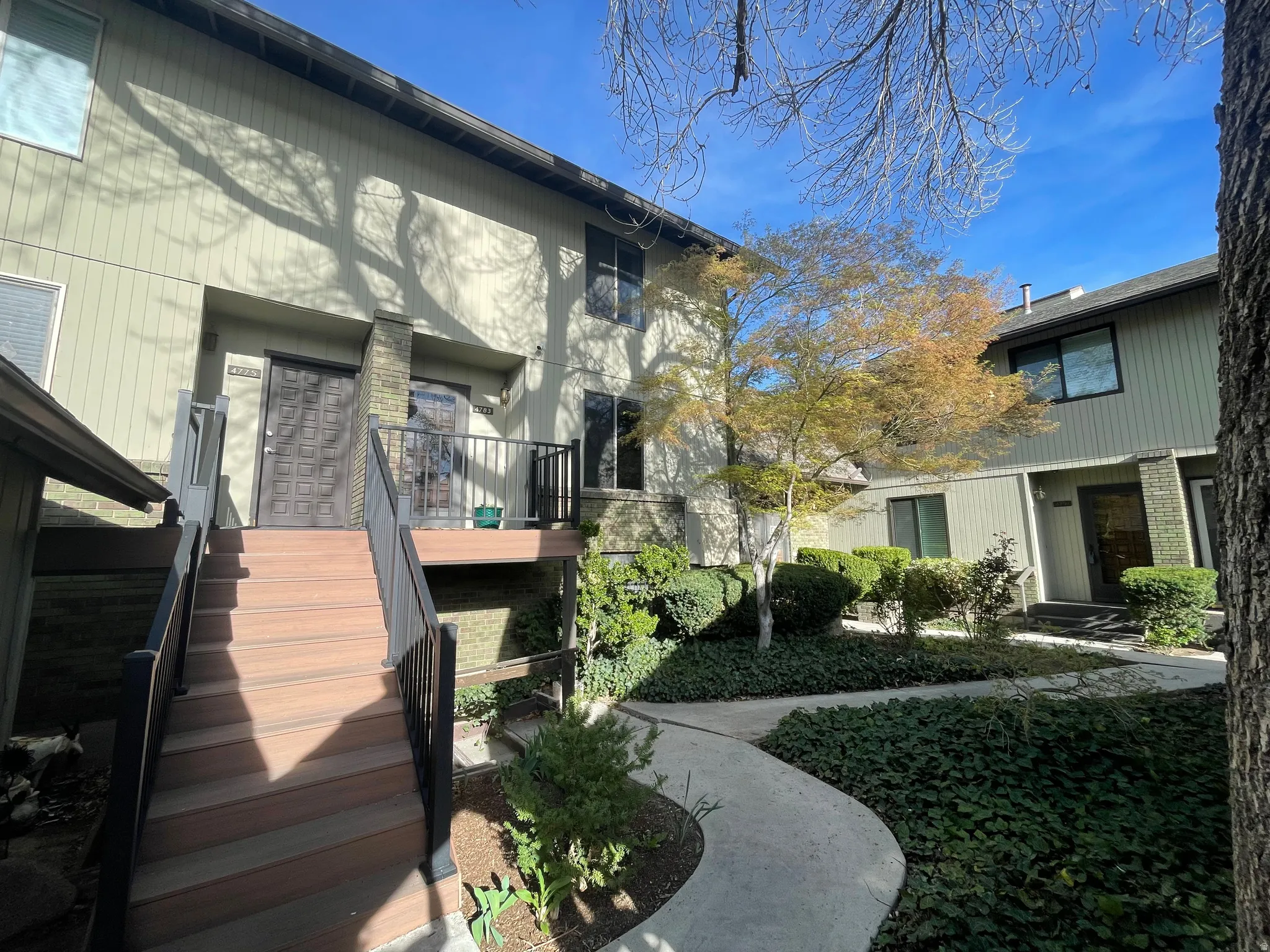 Back of house featuring stairs