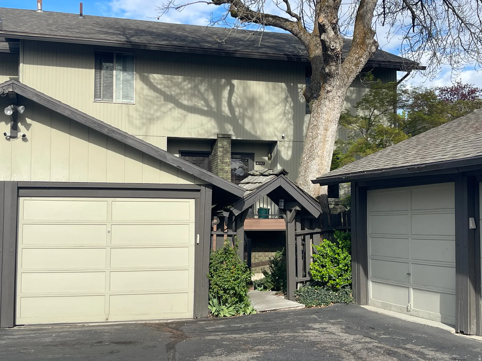 View of front of home featuring a shingled roof
