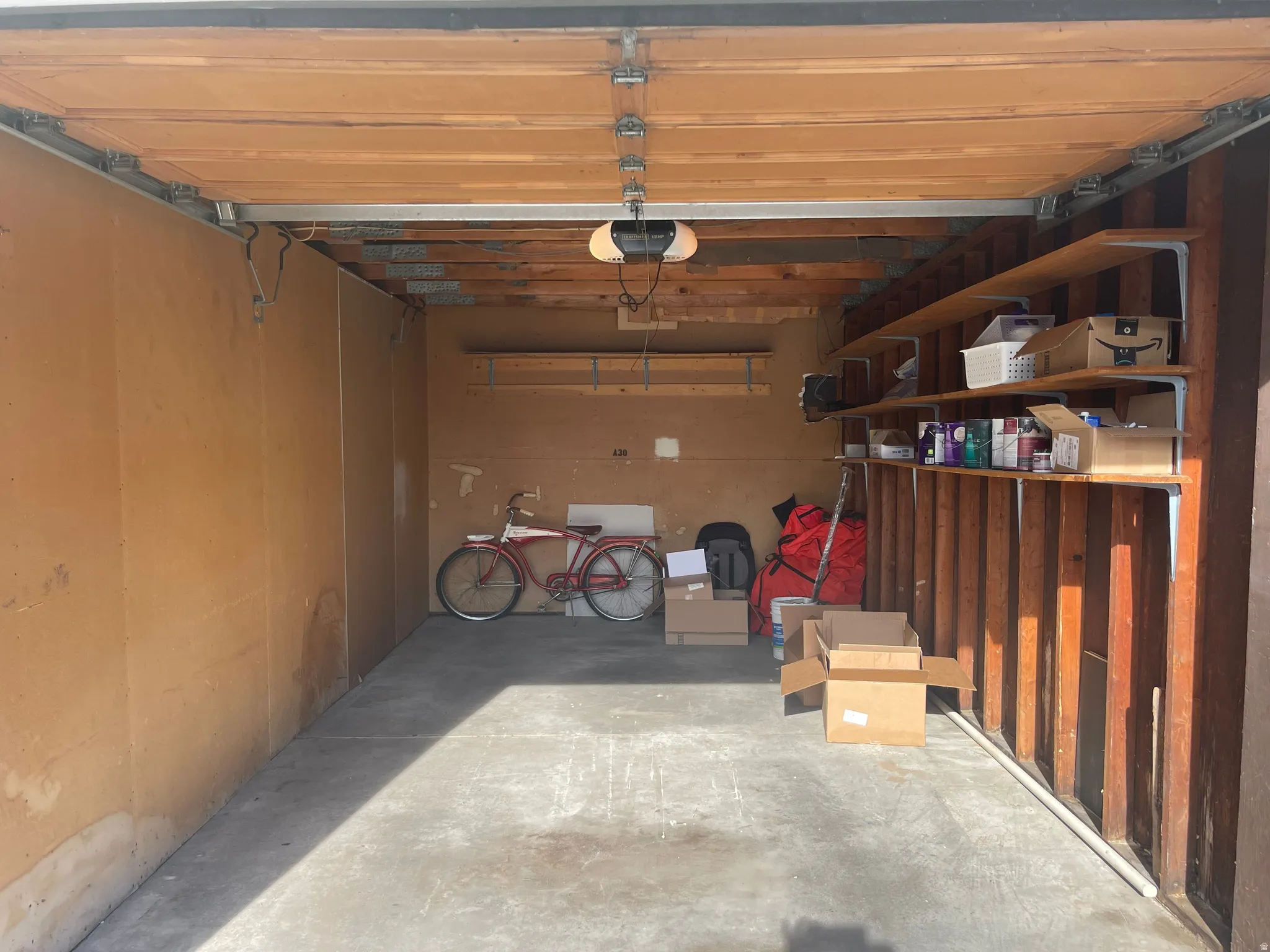 Private single car garage next to condo with a garage door opener