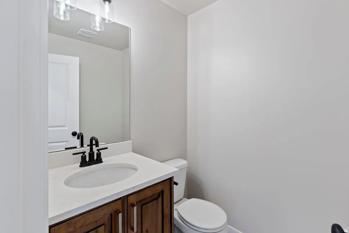Bathroom with vanity and toilet