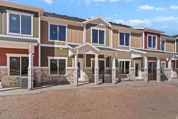 Craftsman-style house featuring stone siding and board and batten siding