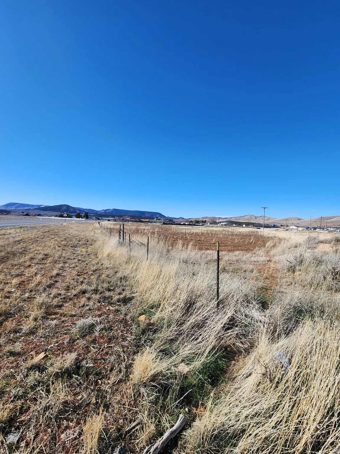 Water view featuring rural landscape and a mountain backdrop