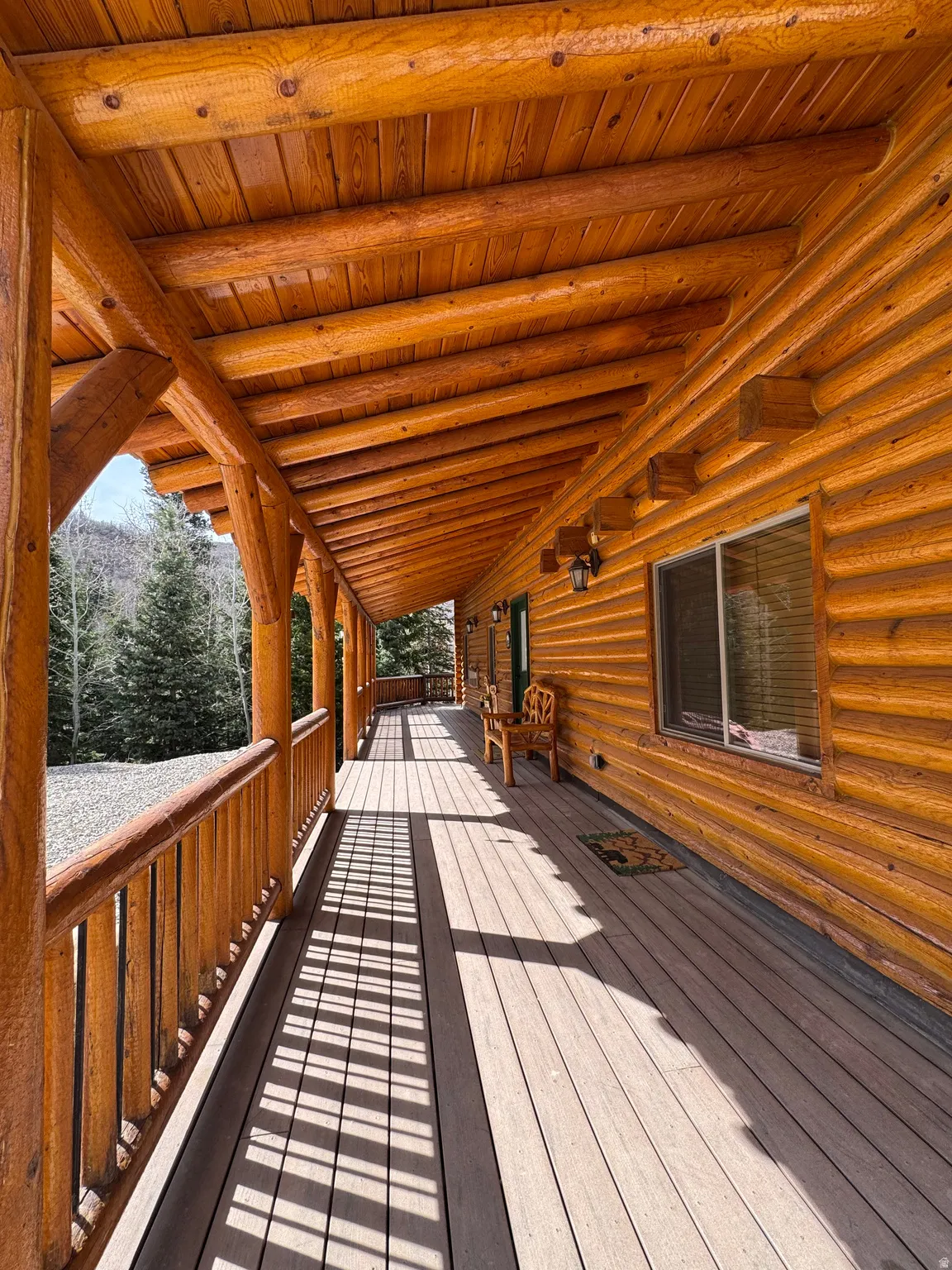 View of cabin entrance with covered deck