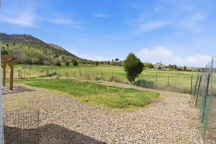 View of yard with a view of rural / pastoral area