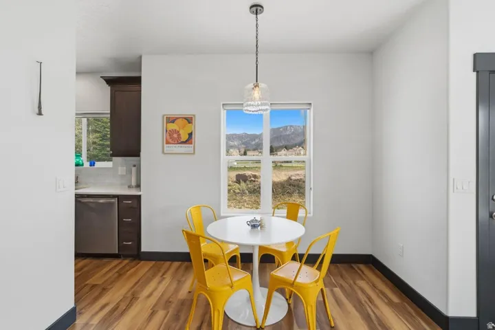 Dining space featuring plenty of natural light, dark wood finished floors, and a mountain view
