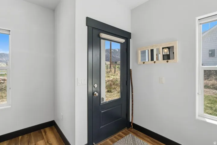 Entryway featuring dark wood-style flooring