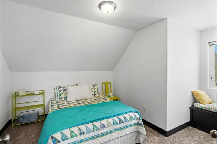 Carpeted bedroom with baseboards