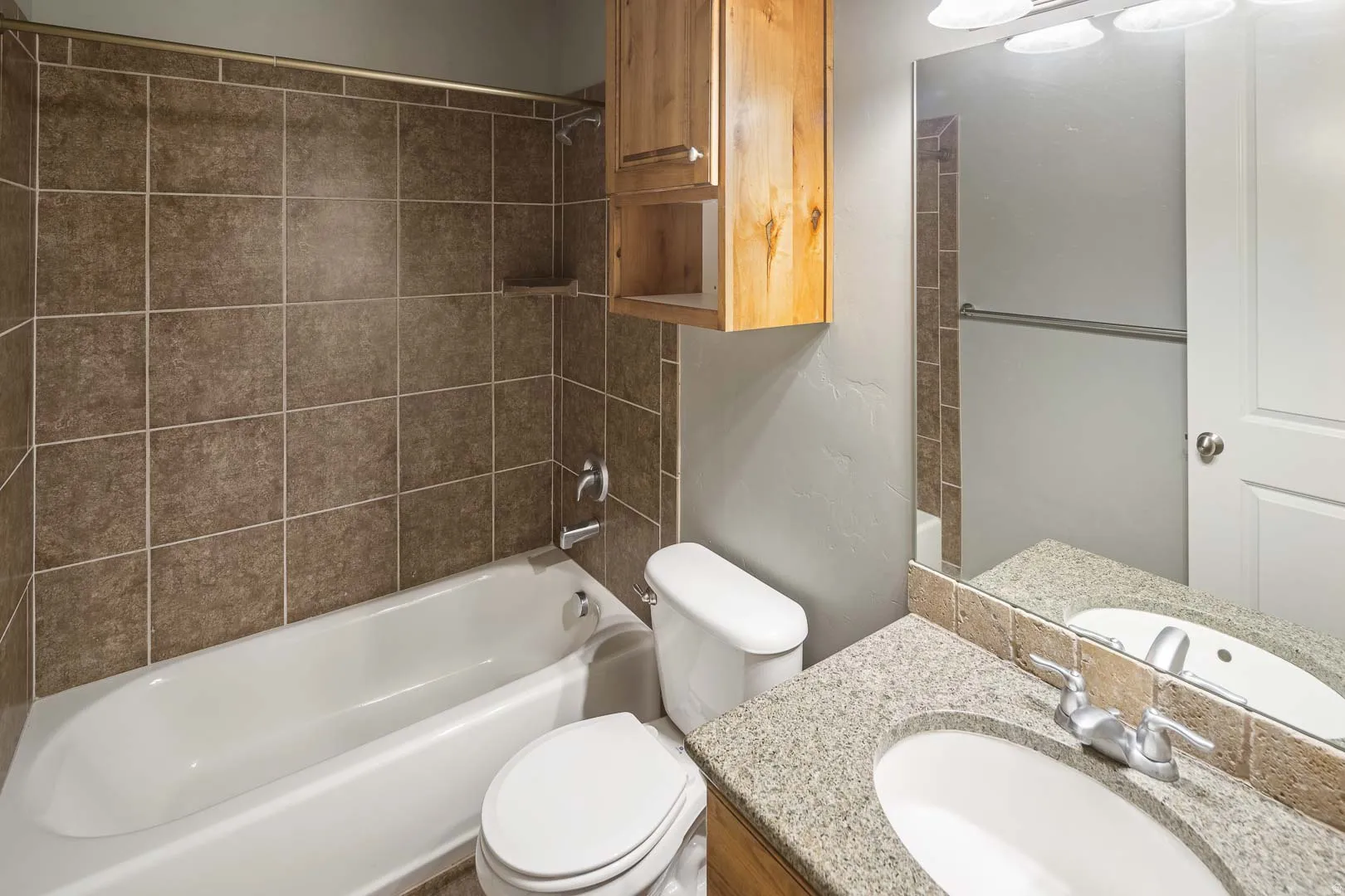 Full bathroom featuring vanity and shower / washtub combination