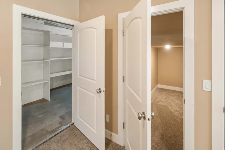 Hallway with light carpet