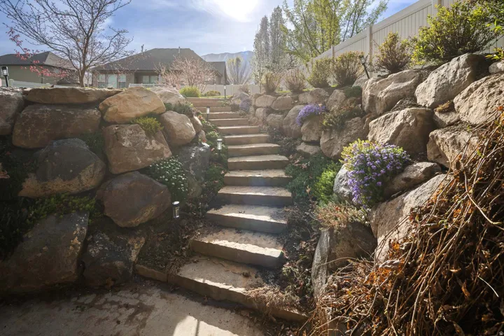 View of yard featuring stairs