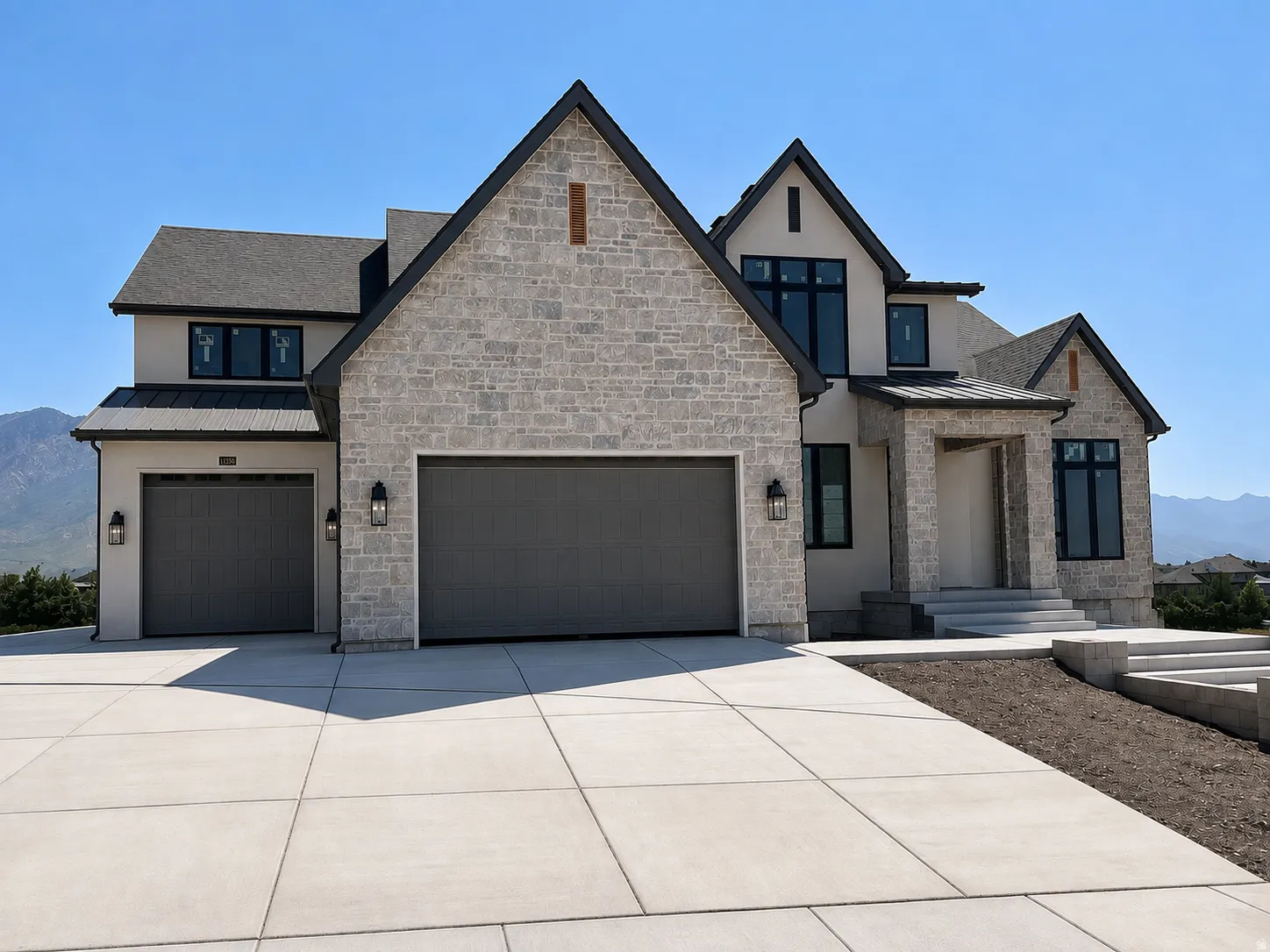 Stone and stucco exterior with dark trim accents