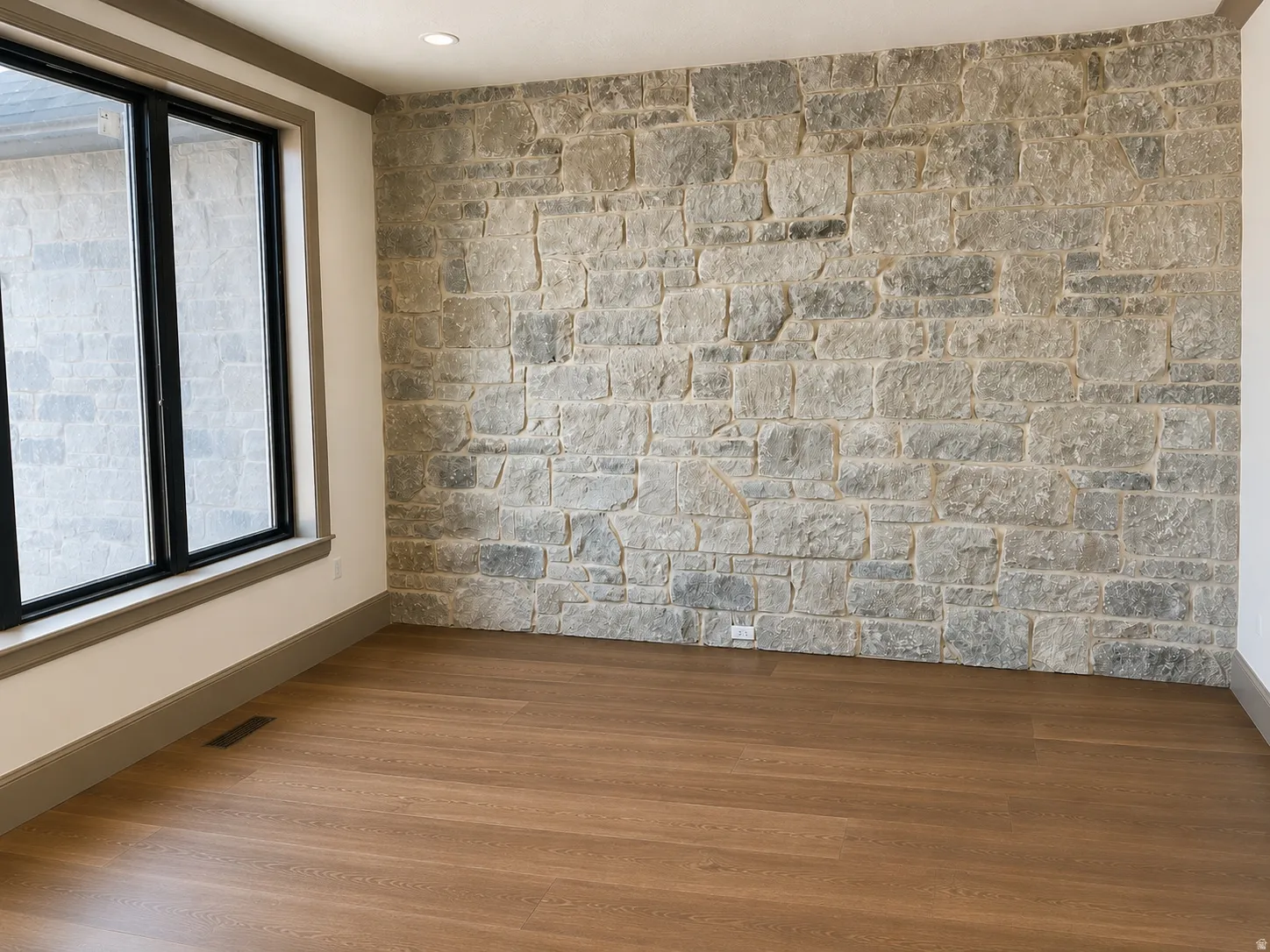 Stone accent wall featuring varied gray tones