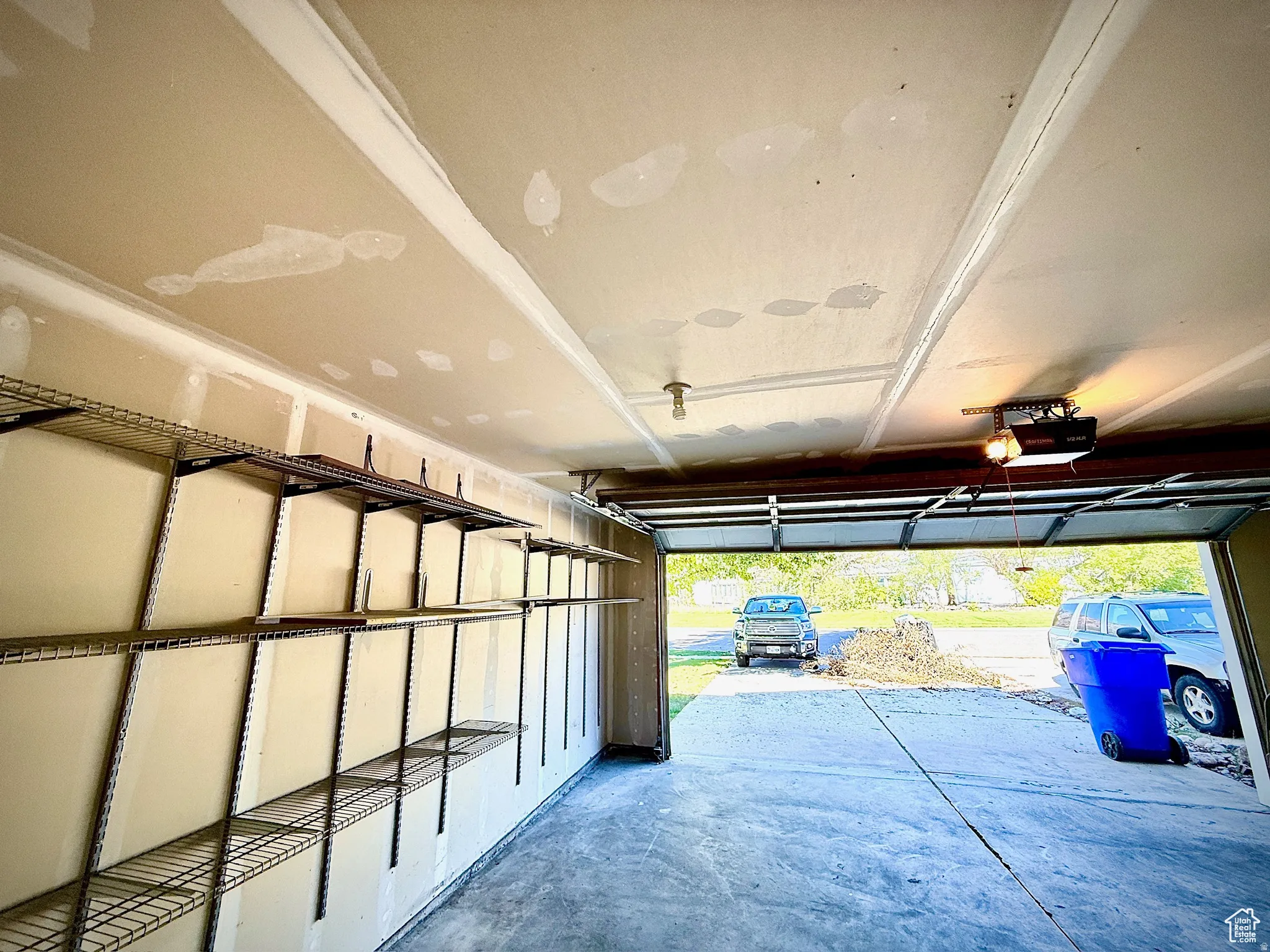 Garage featuring a garage door opener