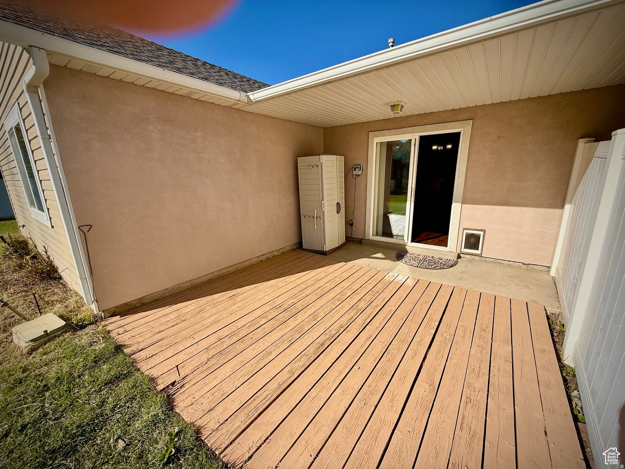 Wooden terrace with a patio area
