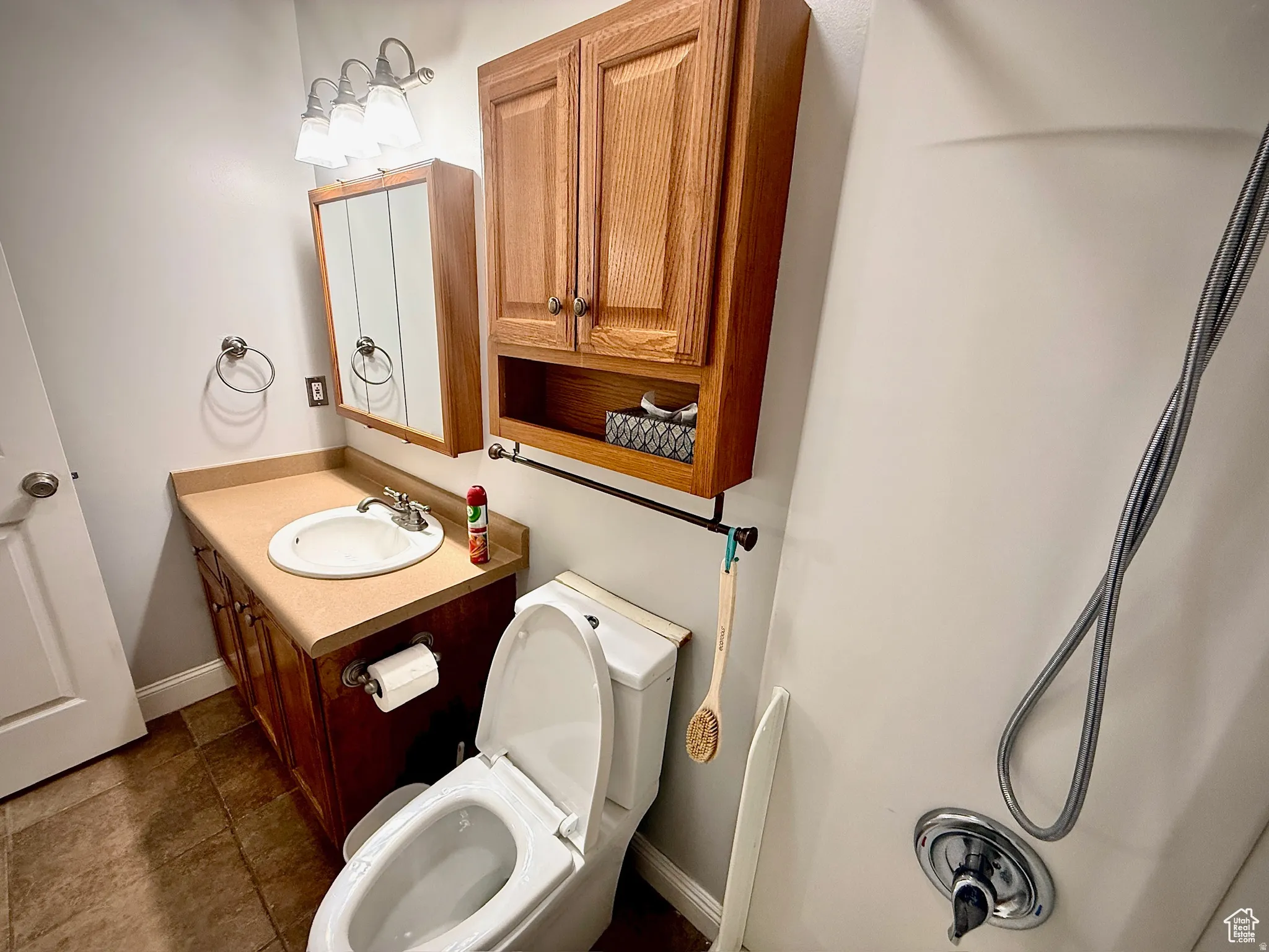 Half bath featuring vanity and toilet