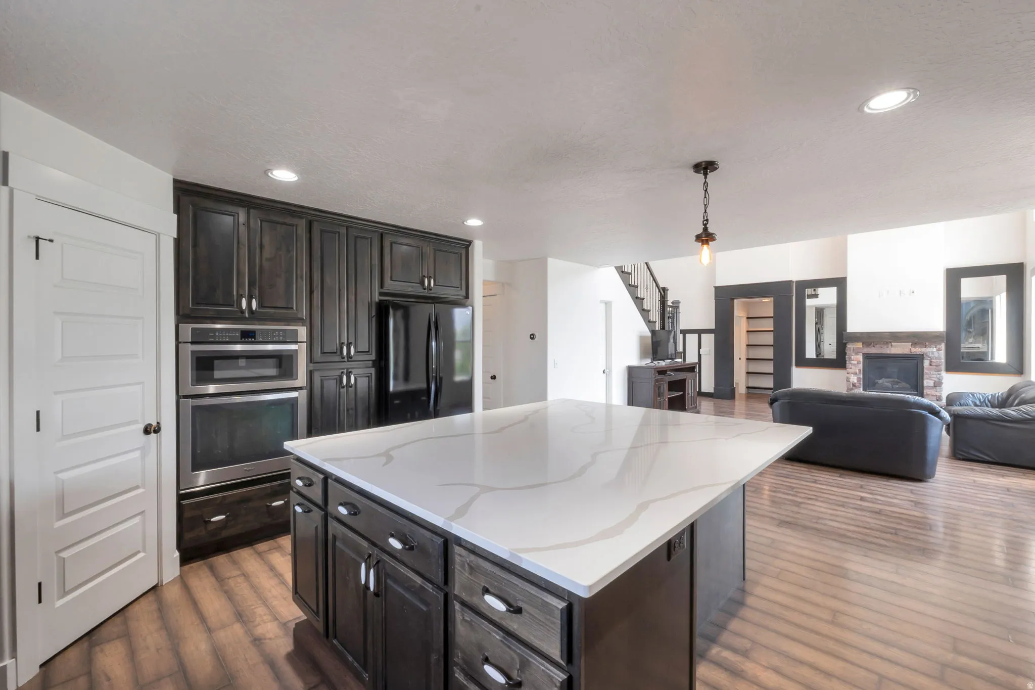 Kitchen island with a white veined countertop