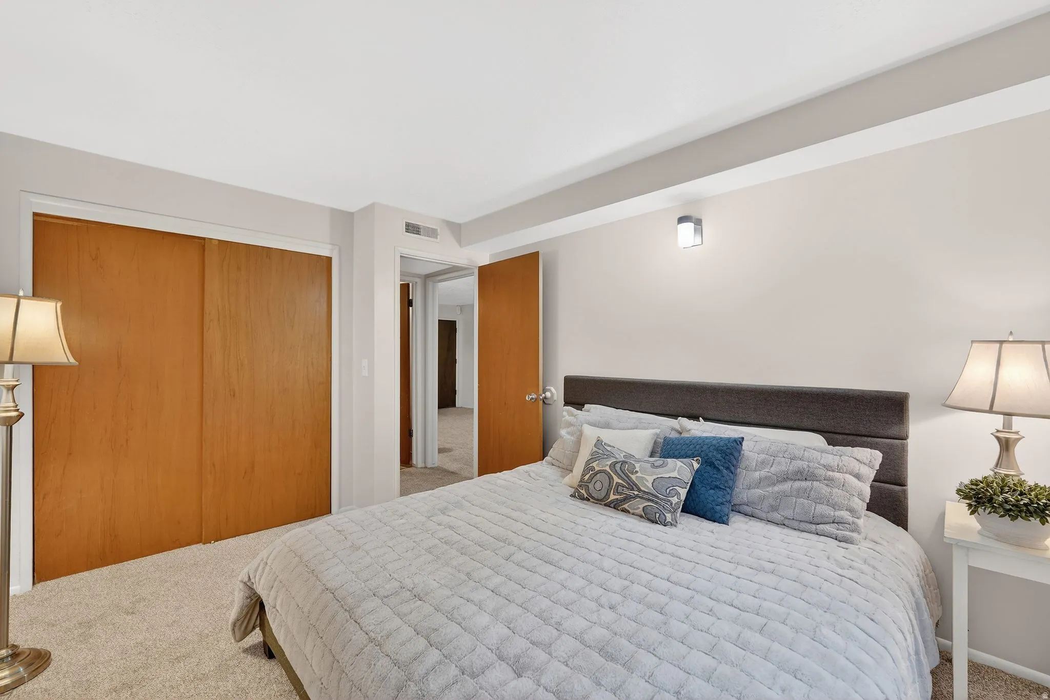 Bedroom with carpet and a closet