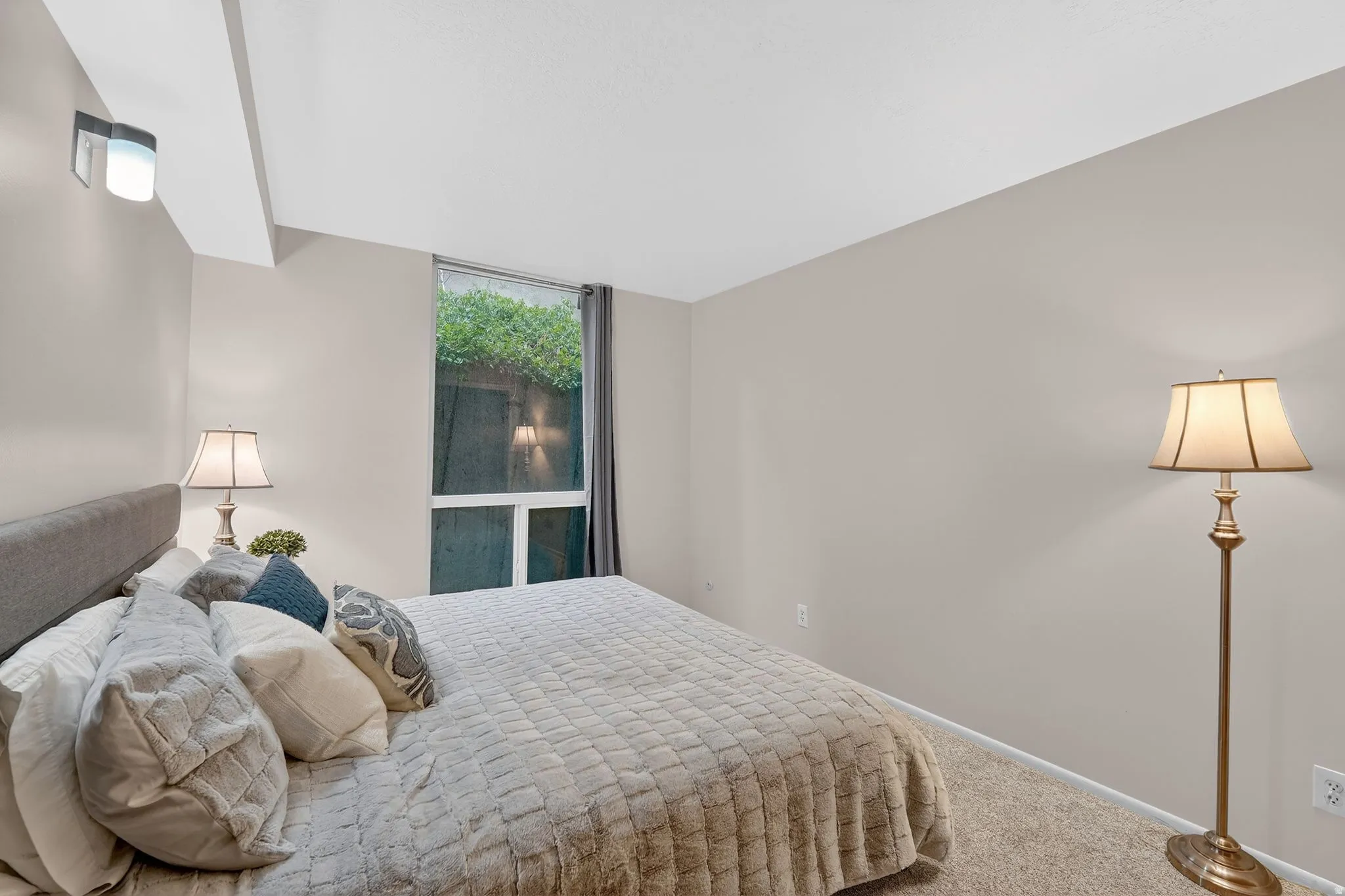 Carpeted bedroom with baseboards