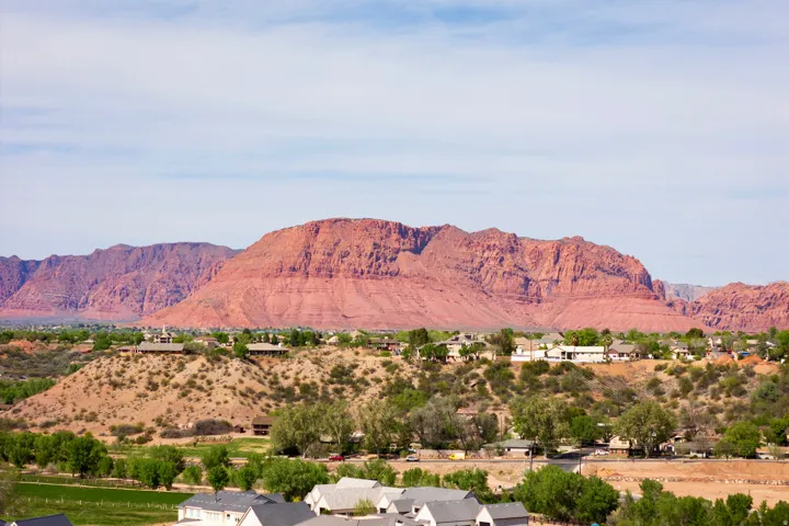 View of mountain background featuring nearby suburban area