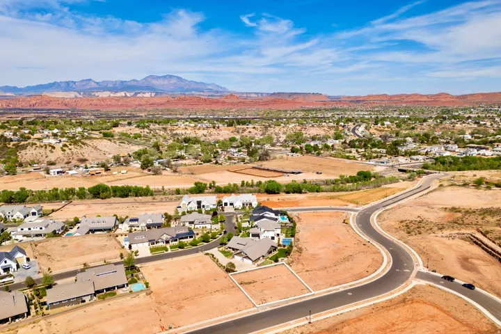 Aerial view of residential area with a mountainous background
