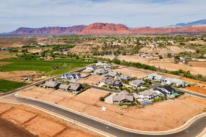 Aerial view of residential area featuring a mountainous background