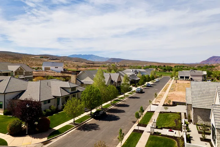Aerial view of residential area featuring mountains