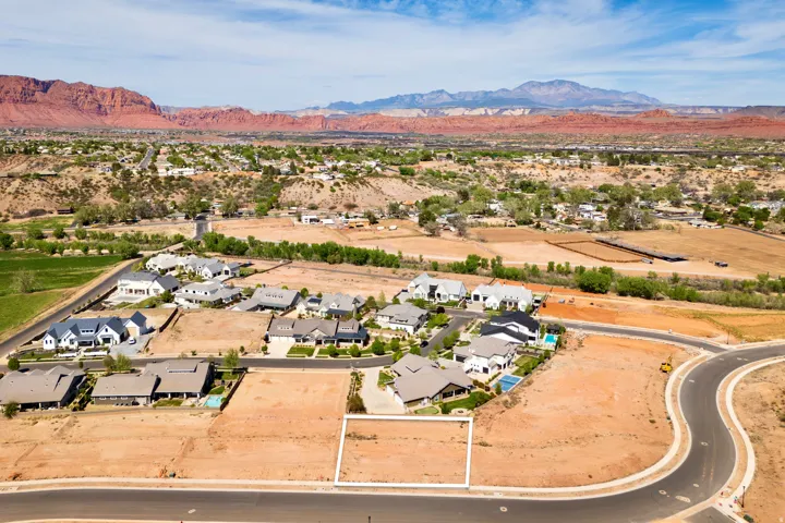 Aerial perspective of suburban area with a mountain backdrop