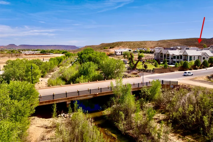 Aerial view of a mountain backdrop and a notable bridge