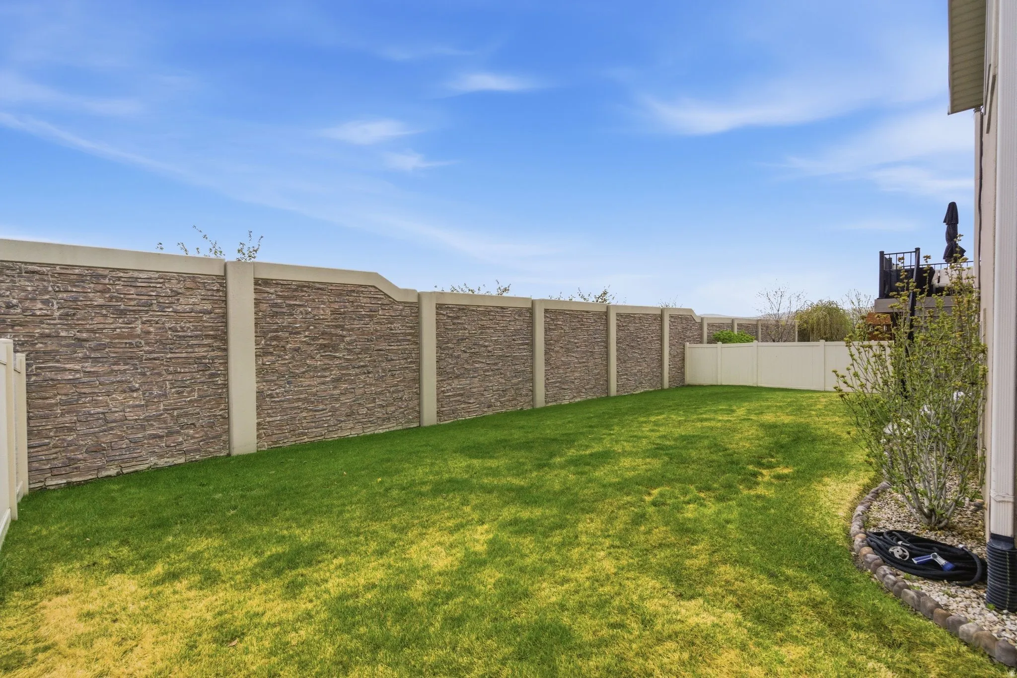 View of fenced backyard