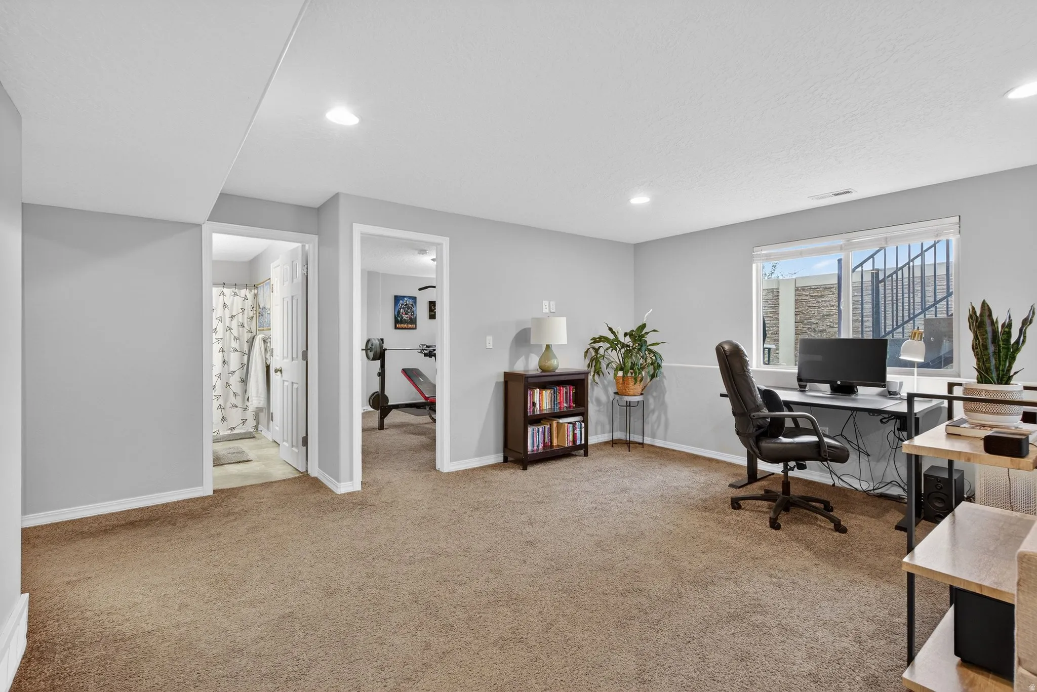 Office space featuring light carpet and recessed lighting