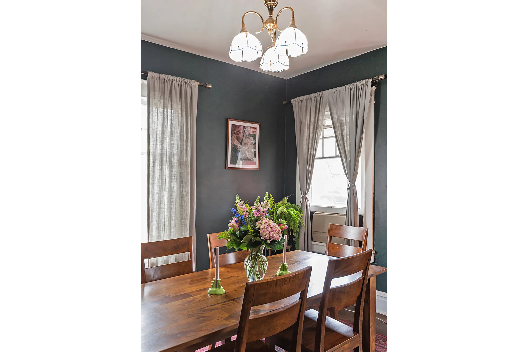 Dining space featuring hanging lights and wood finished floors