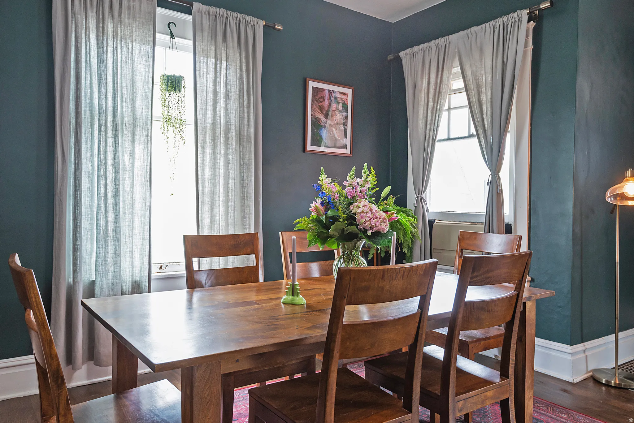 Dining space featuring wood finished floors and healthy amount of natural light