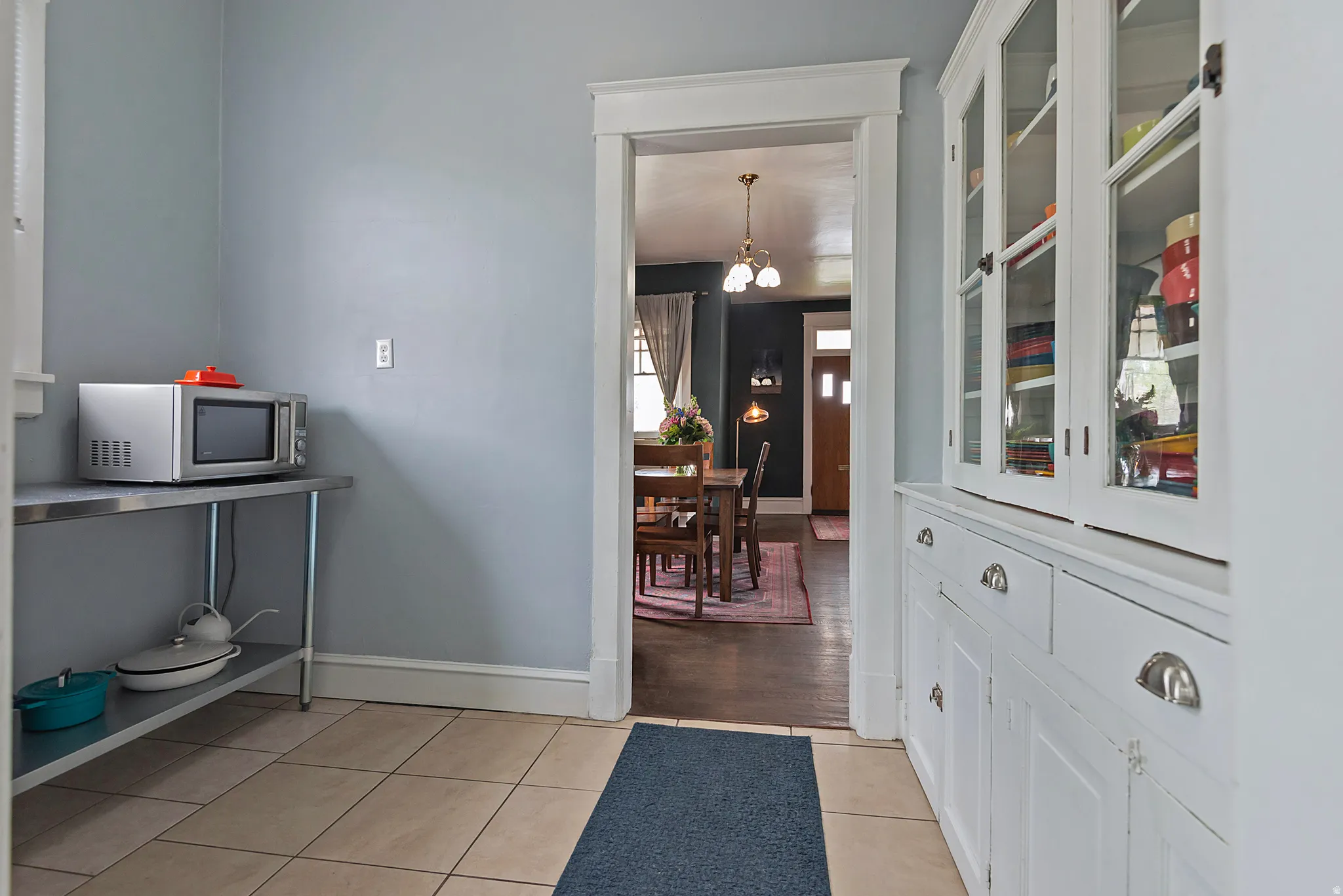Foyer entrance featuring baseboards and light tile patterned floors