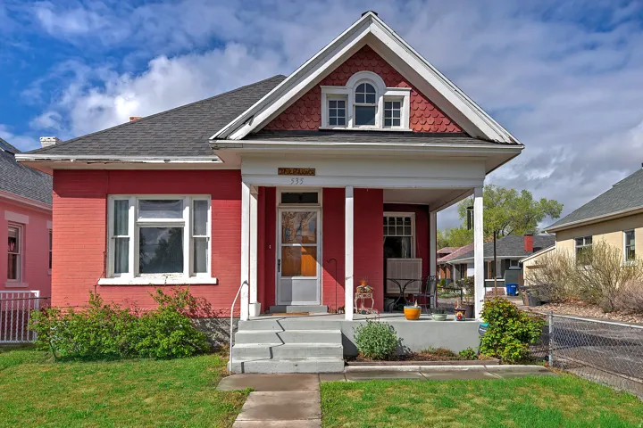 View of front of house with a porch and roof with shingles