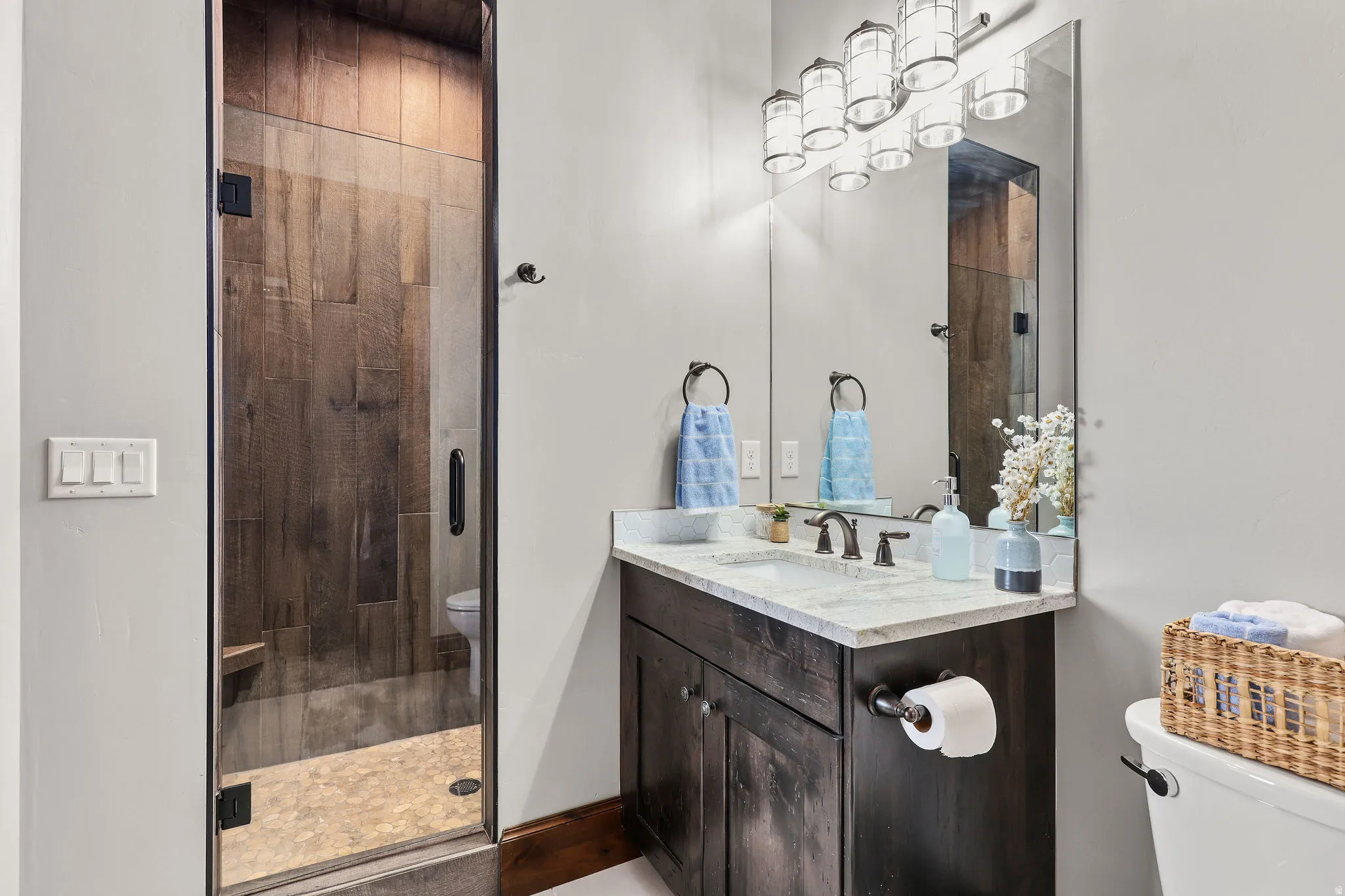 Bathroom with vanity and a stall shower