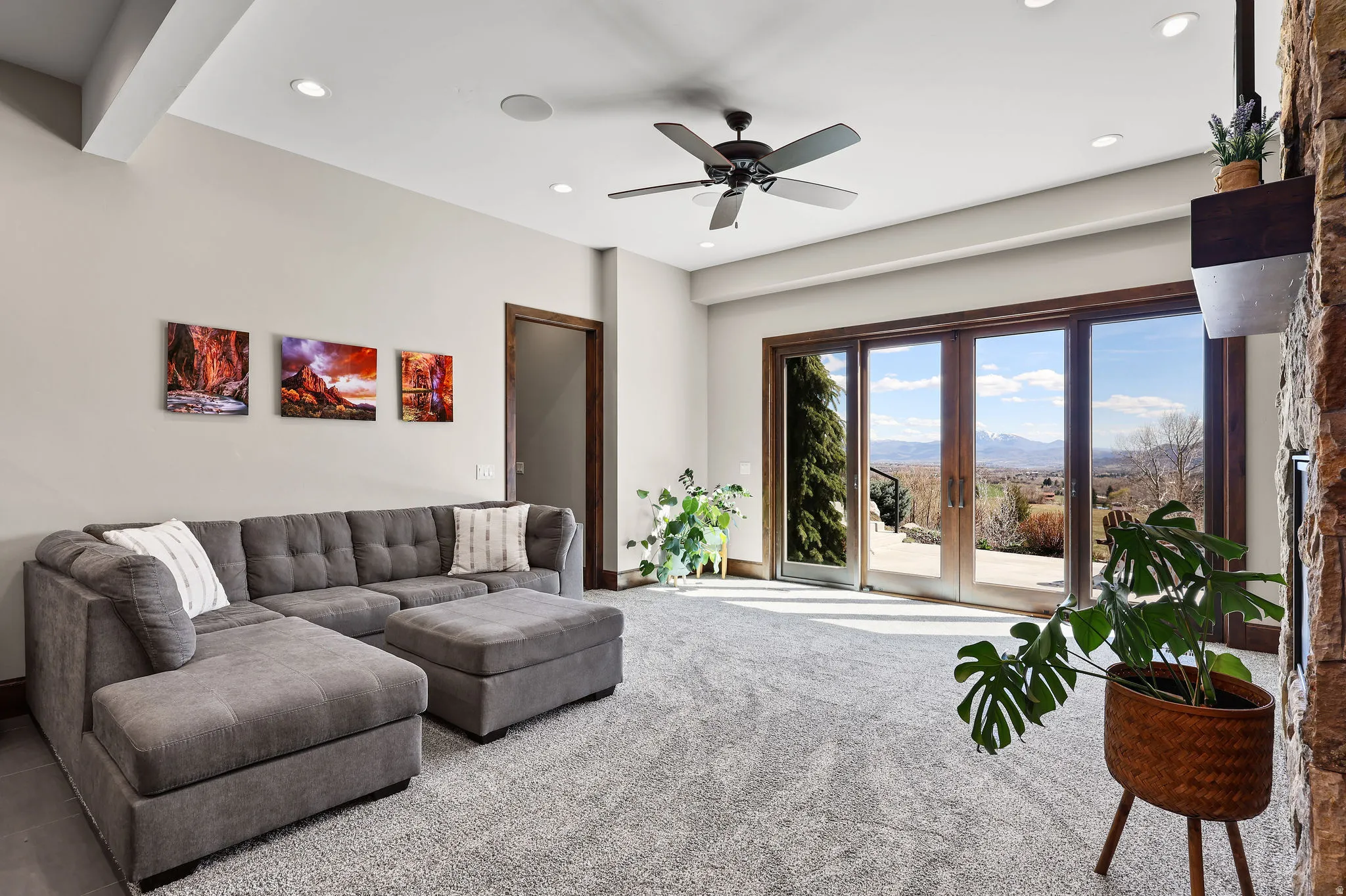 Carpeted living area featuring a mountain view, ceiling fan, and recessed lighting