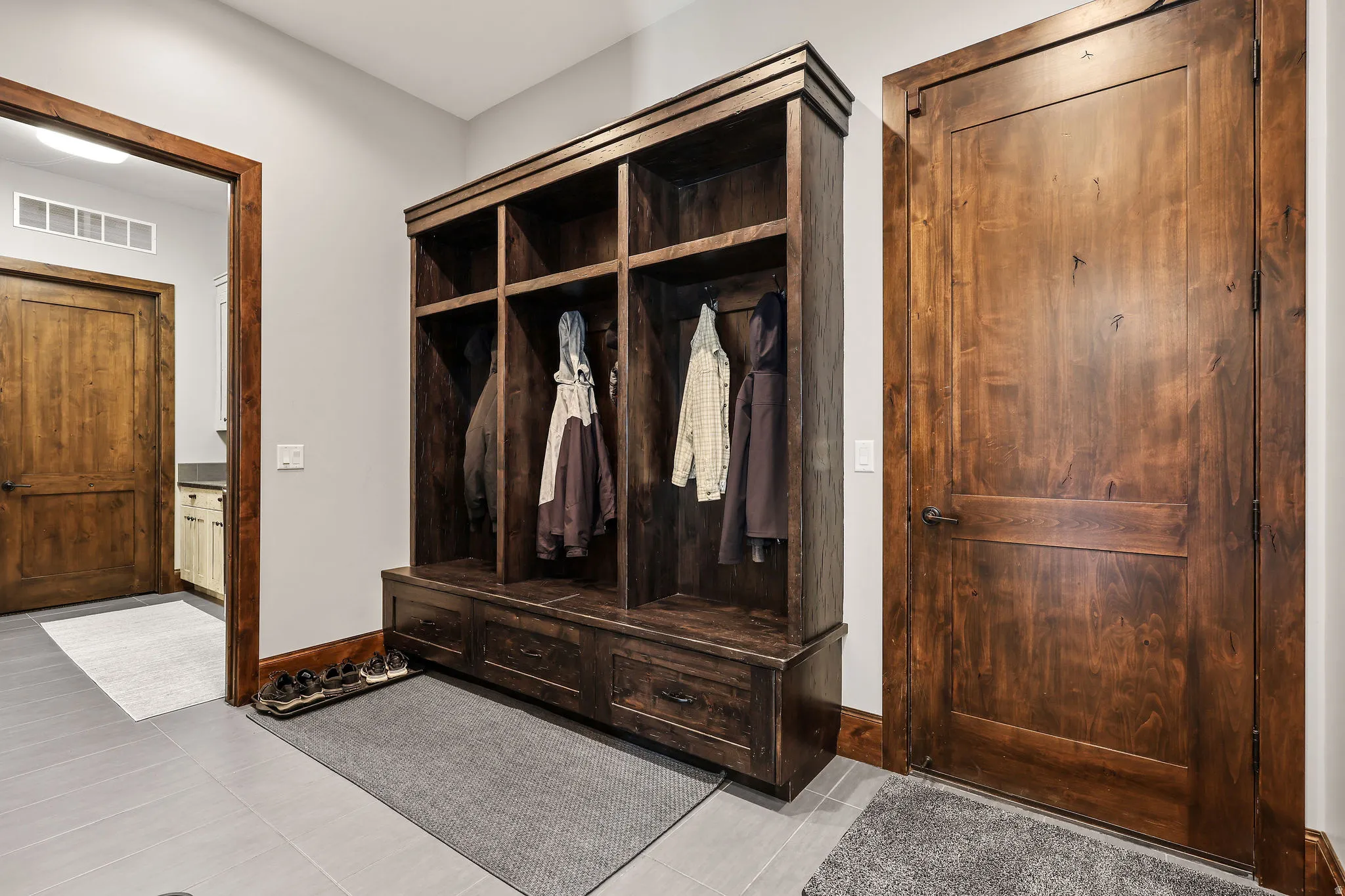 Mudroom featuring light tile patterned flooring