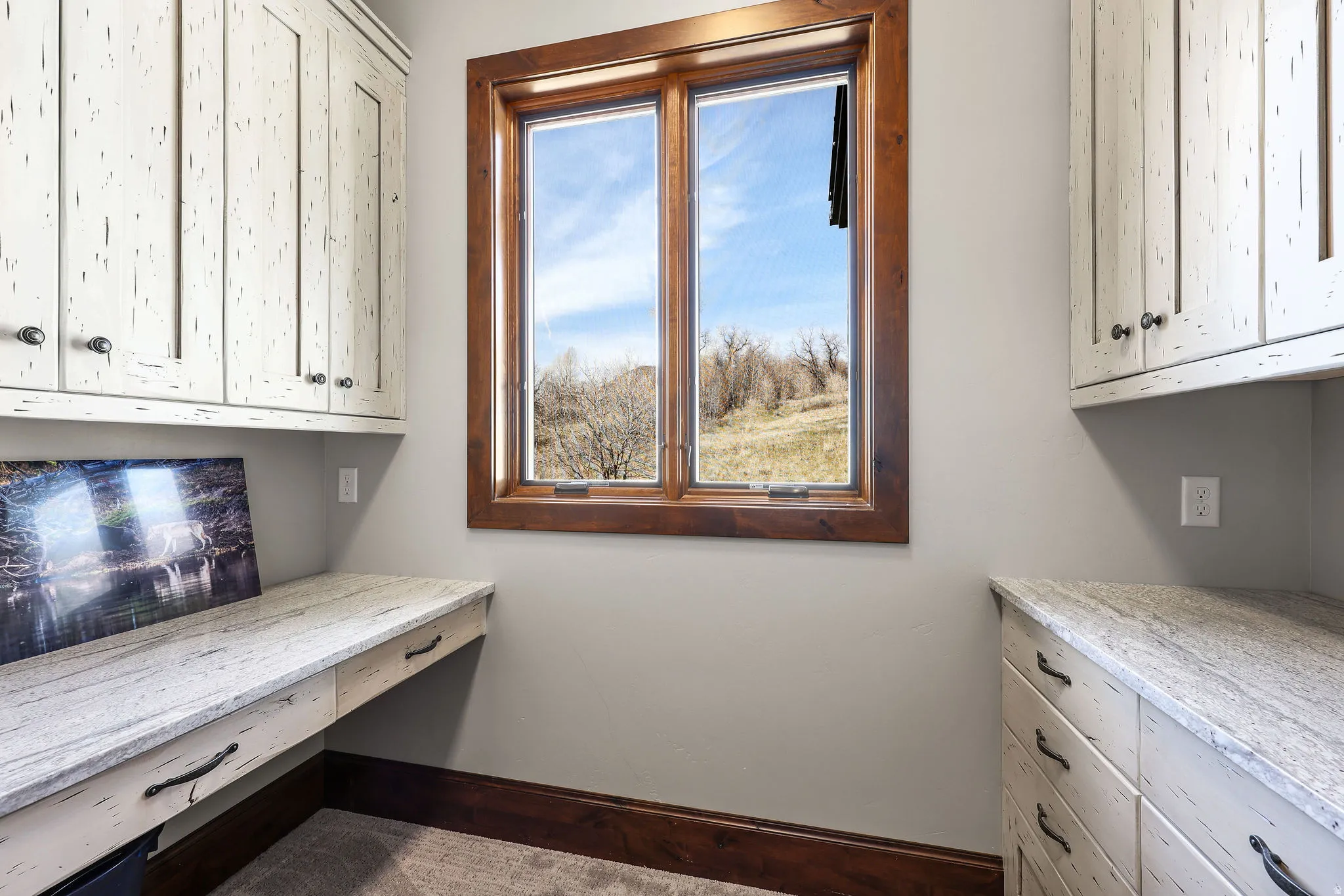 Office space featuring built in study area and baseboards