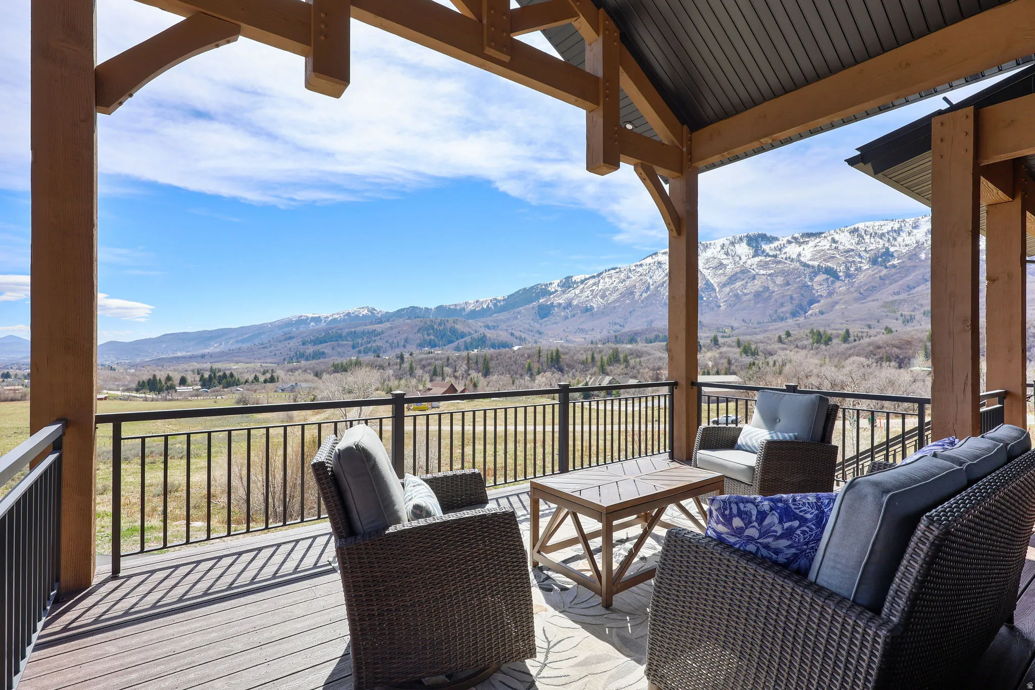 Deck with a mountain view, an outdoor lounge area, and a patio