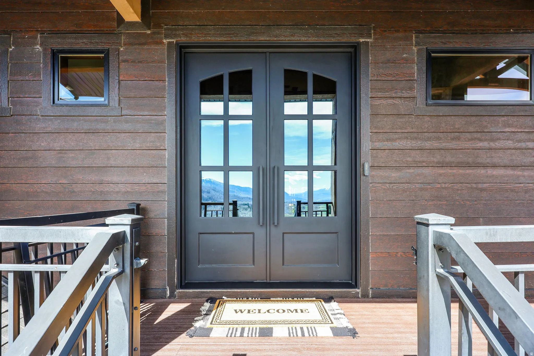 Entrance to property with french doors and a mountain view