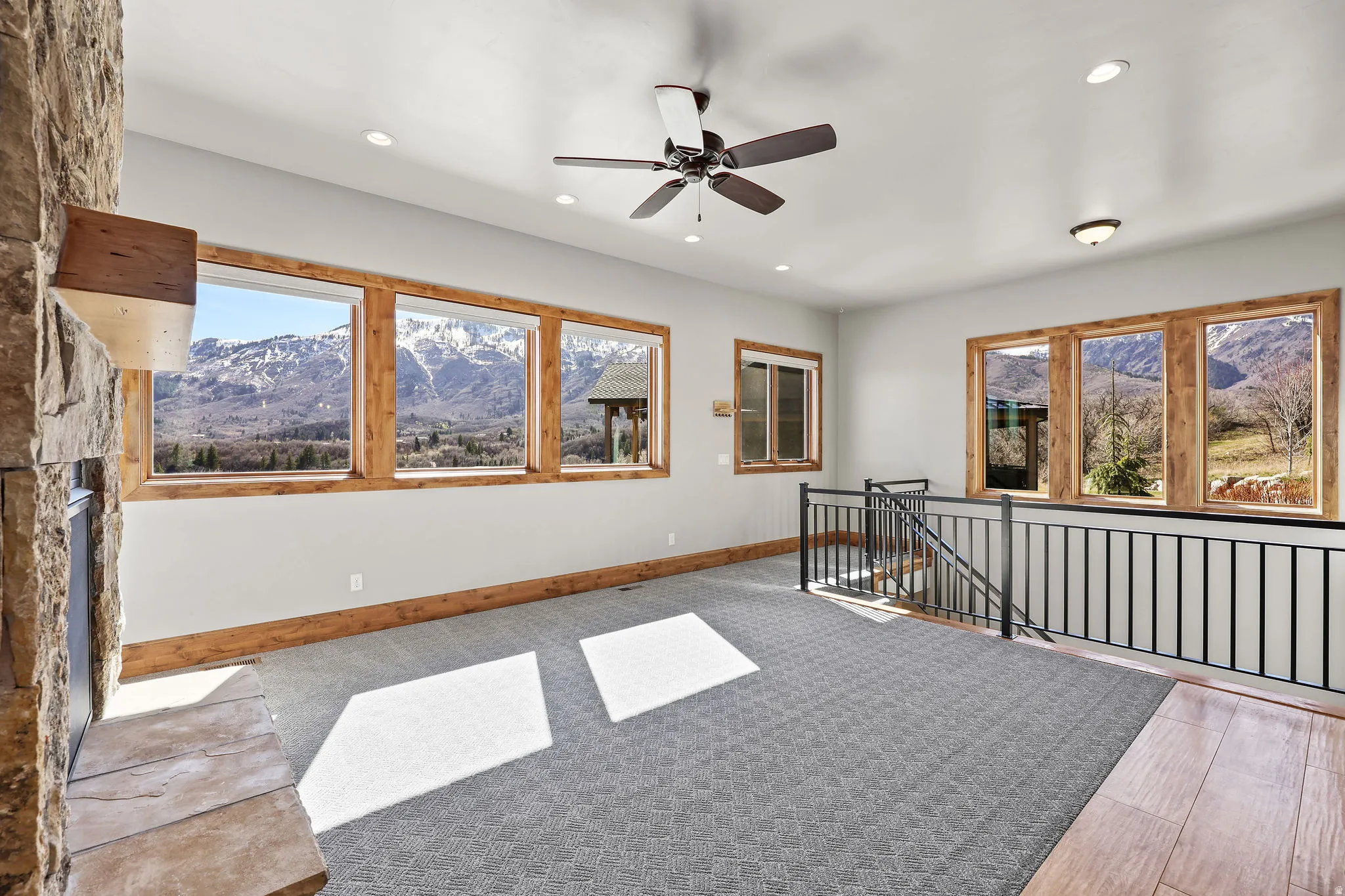 Unfurnished room with a mountain view, a ceiling fan, and recessed lighting