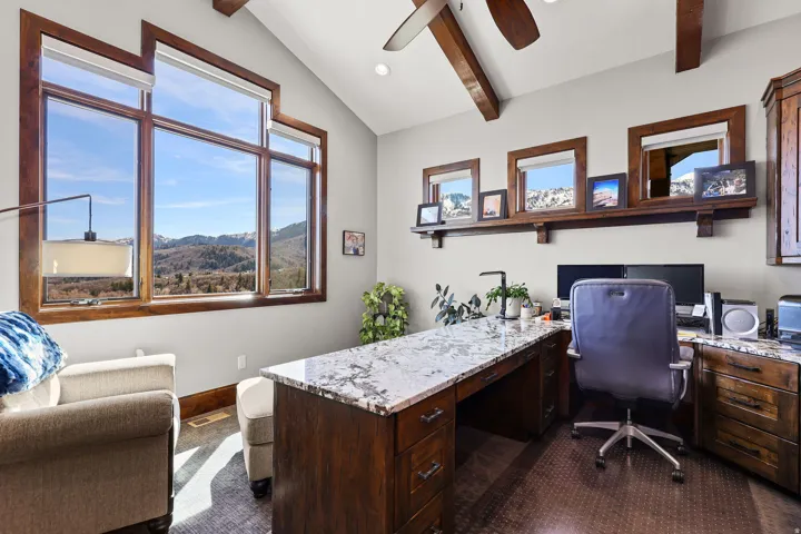 Office with a ceiling fan, built in study area, vaulted ceiling with beams, and recessed lighting