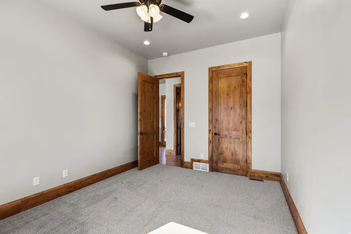 Unfurnished room featuring carpet floors, a ceiling fan, and recessed lighting