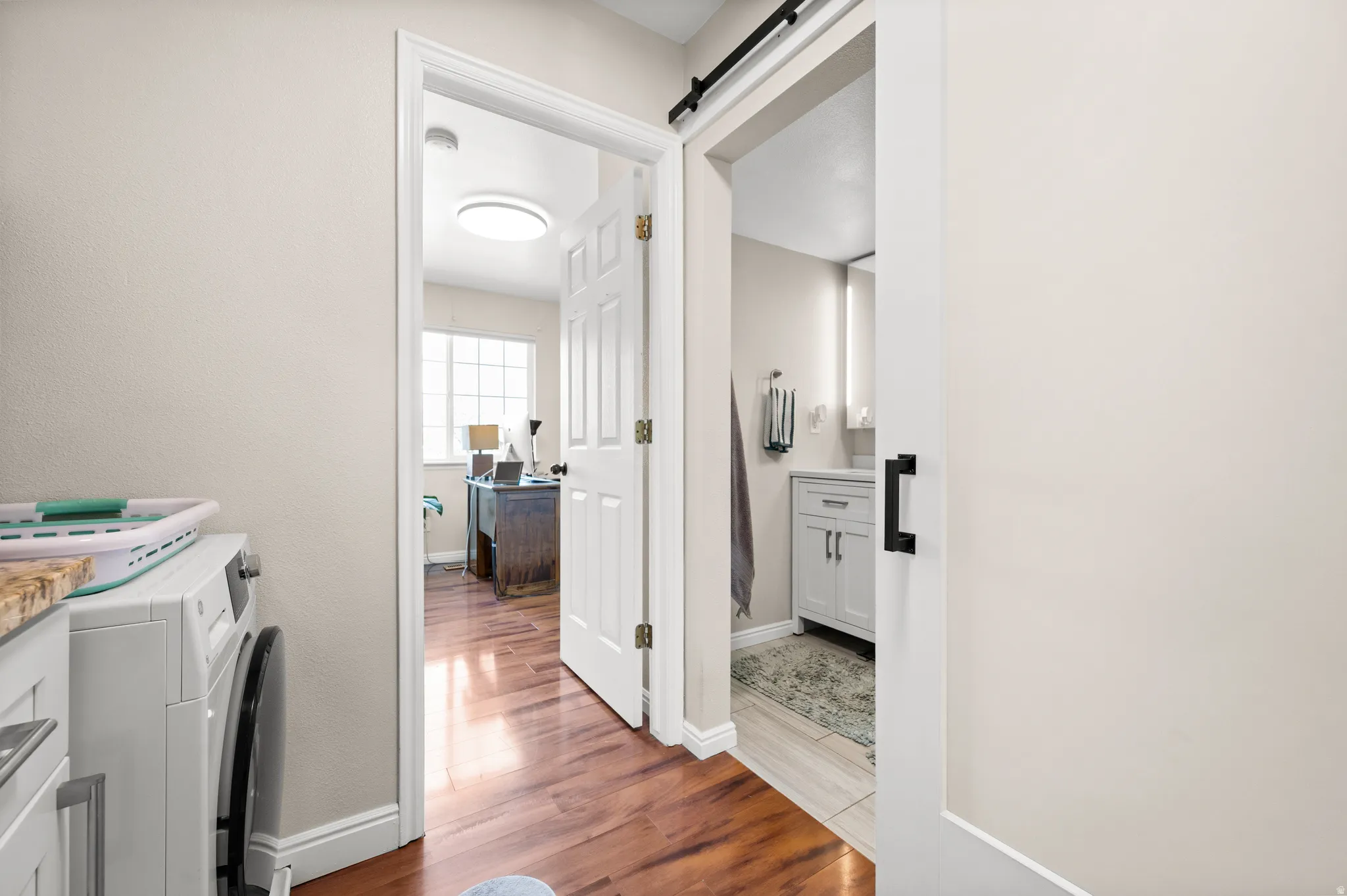 Lundry room, 2nd bedroom and custom barn door to bathroom