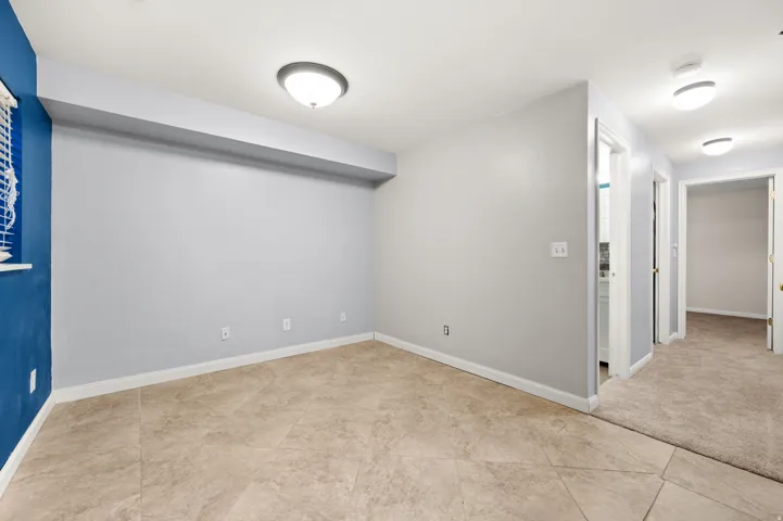 Famliy room loacted in basement with tile floor