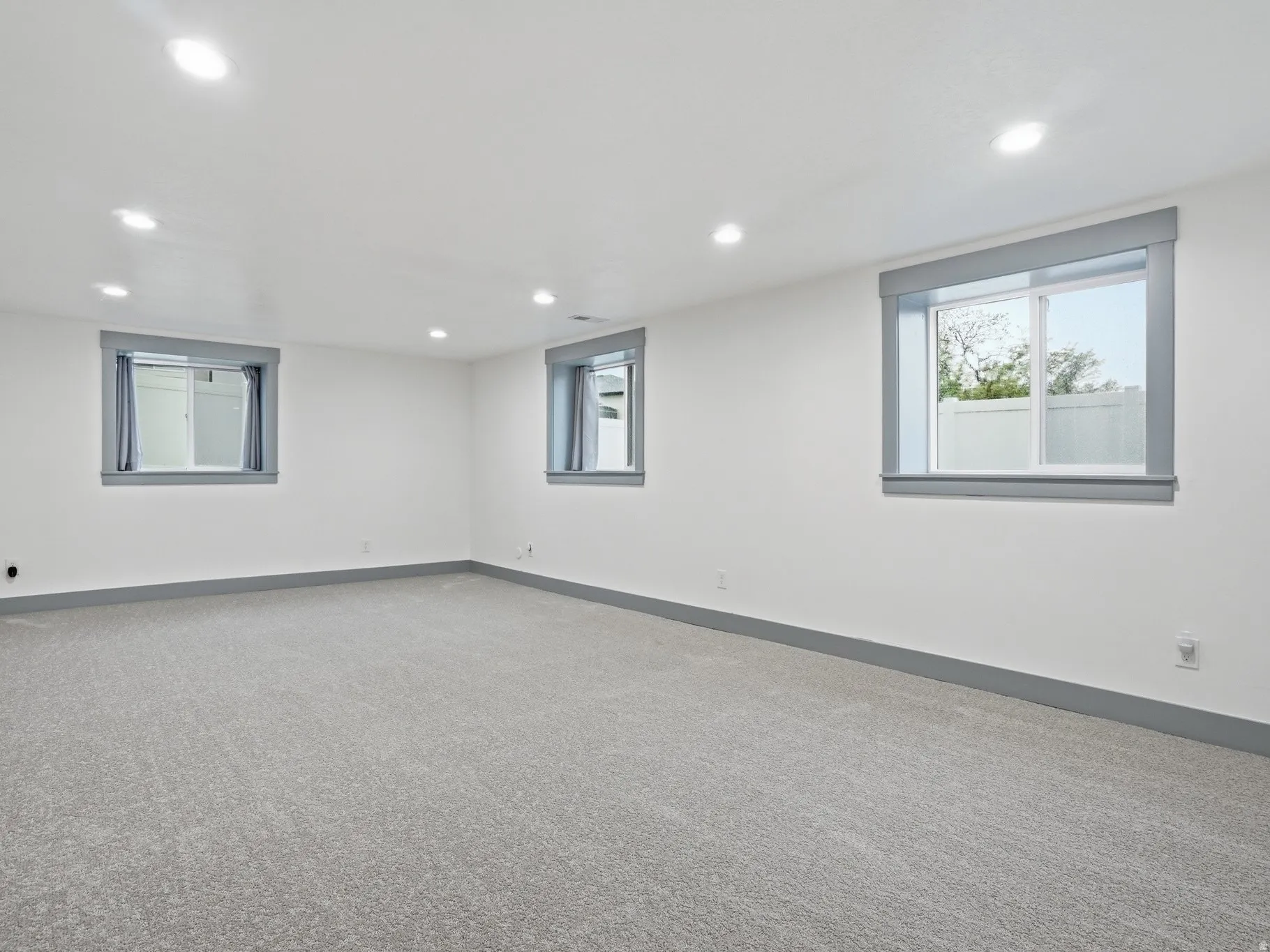 Basement featuring carpet flooring and recessed lighting