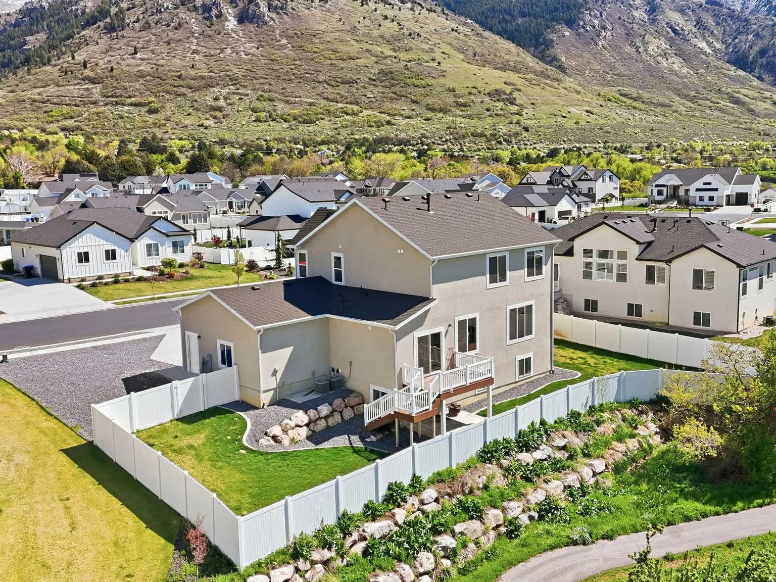 Aerial perspective of suburban area with a mountainous background