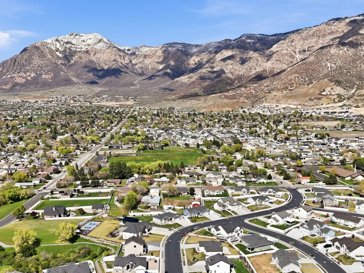 Aerial view of residential area with a mountainous background